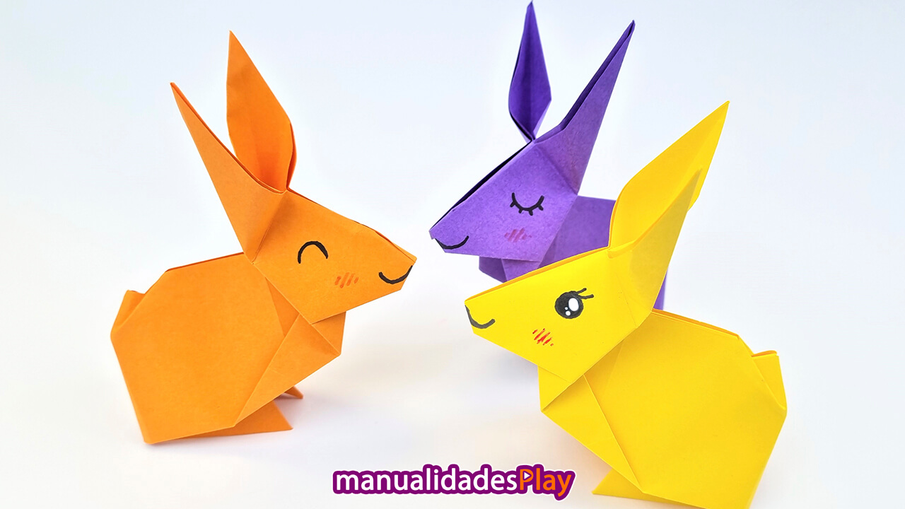 Conejos de origami (de izquierda a derecha: naranja, morado y amarillo)